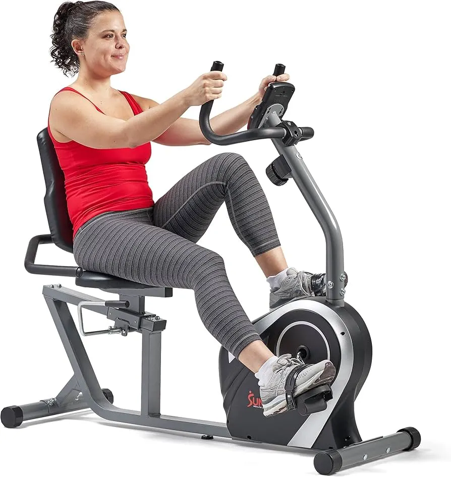 Lady Using Sunny Health & Fitness Stationary Exercise Bike